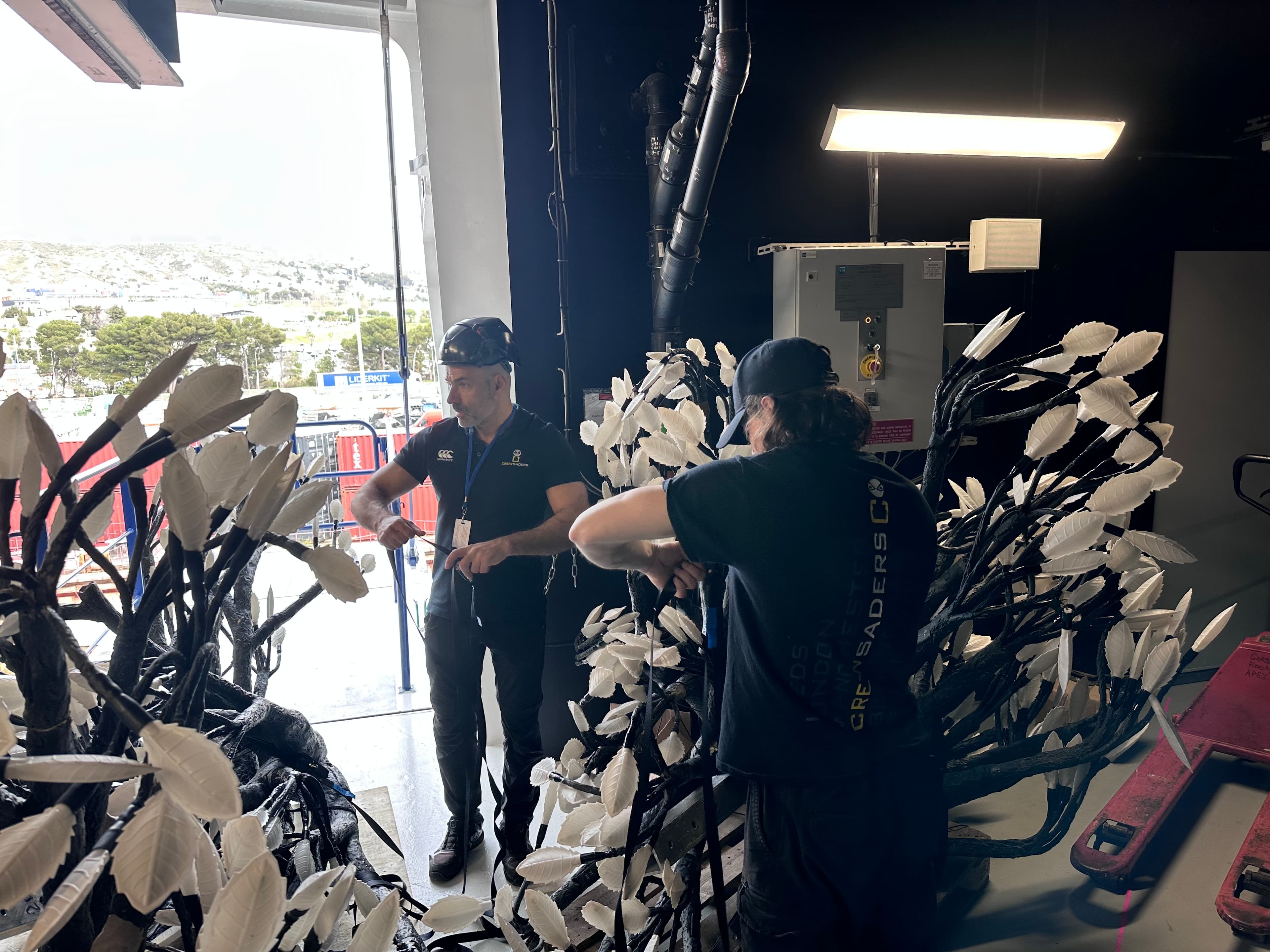 Crewsaders crew assisting an exhibitor with stand build and prop installation during move-in